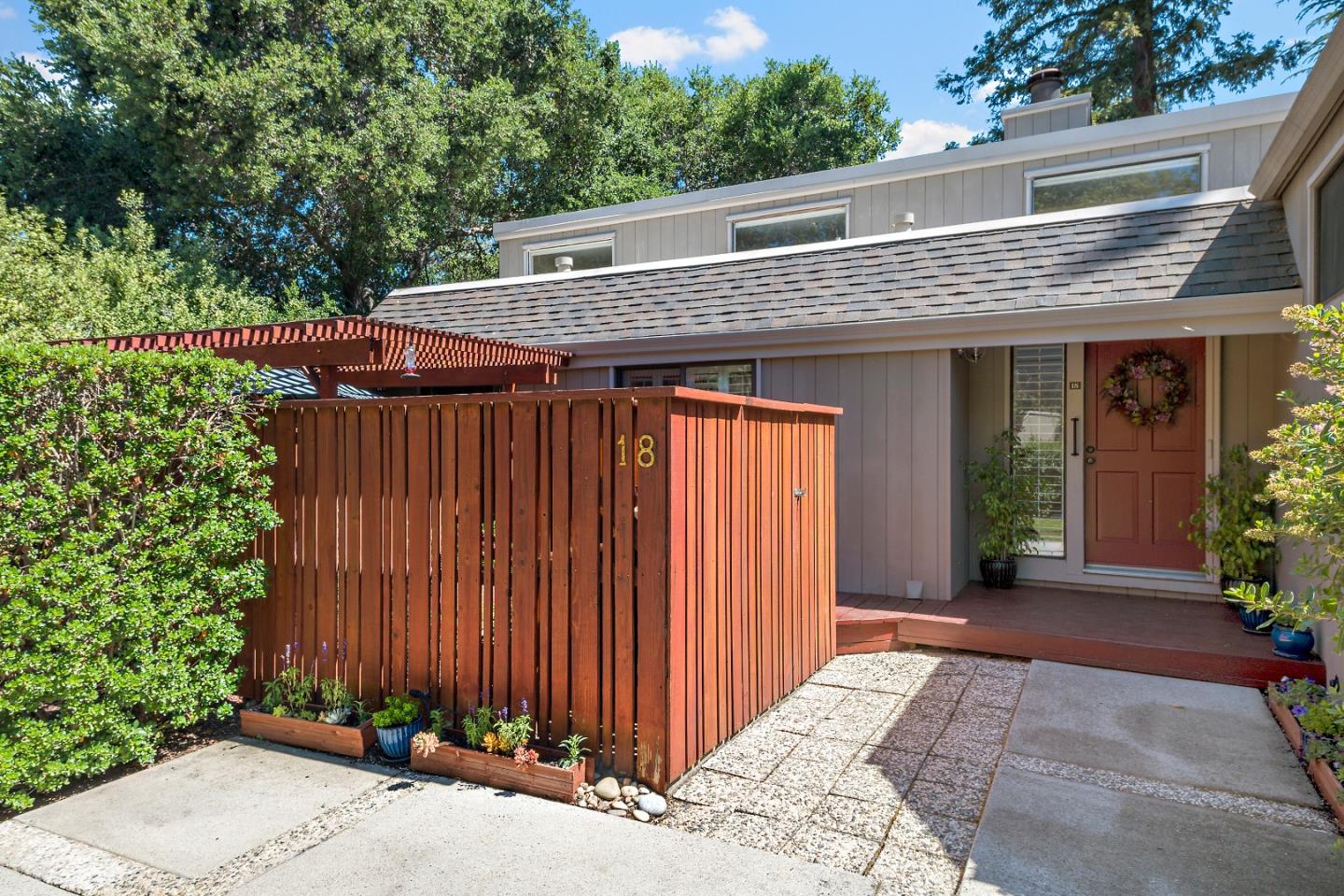 18 Farm Road Los Altos, CA 94024 - Photo 2 of 27 a front view of a house with garden