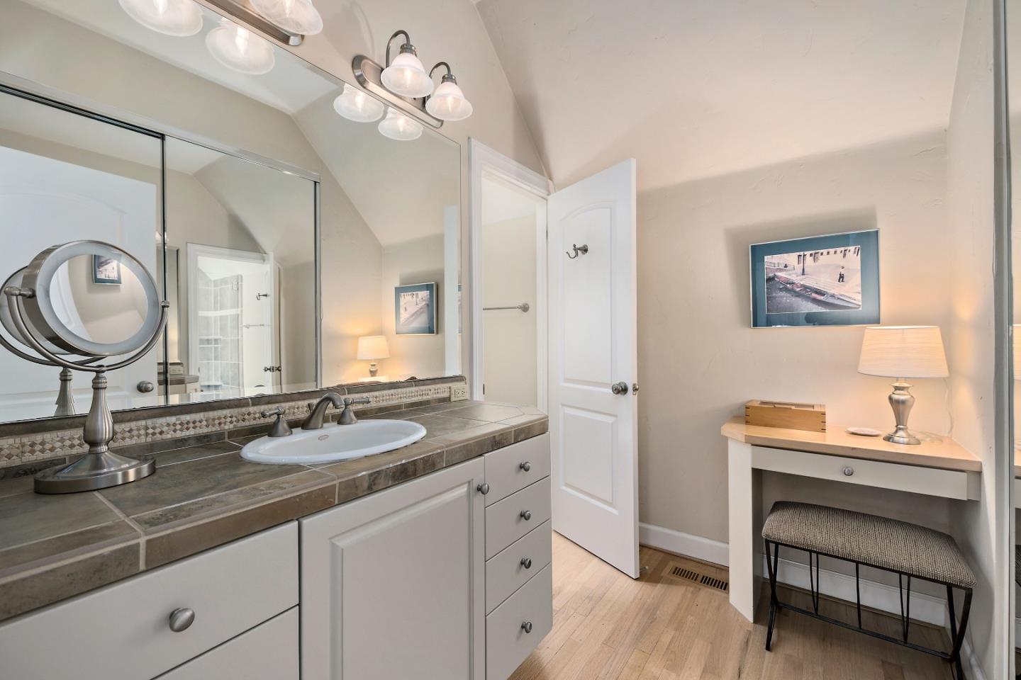 18 Farm Road Los Altos, CA 94024 - Photo 16 of 27 a bathroom with a sink a vanity and a mirror