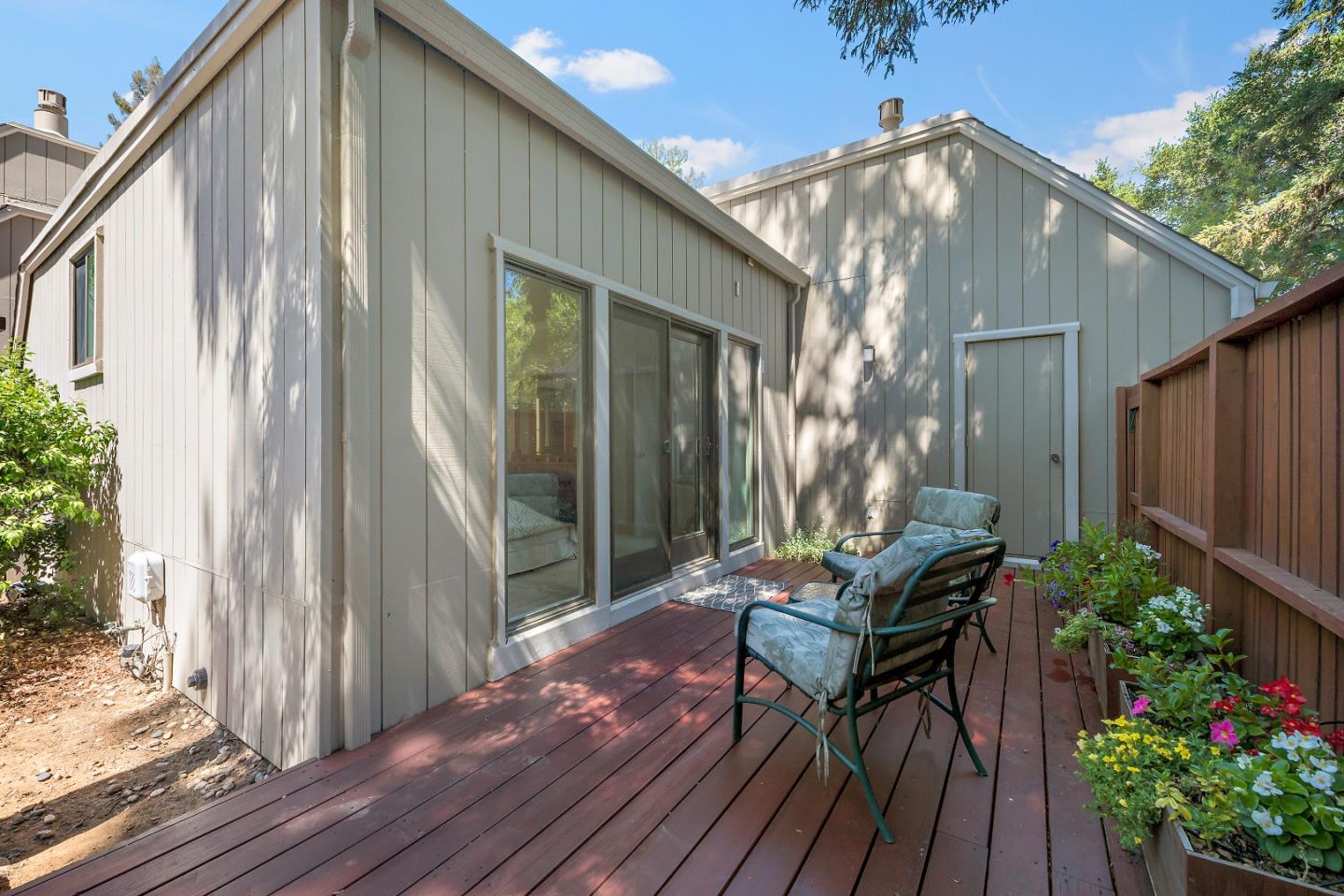 18 Farm Road Los Altos, CA 94024 - Photo 22 of 27 a backyard of a house with wooden floor and outdoor seating