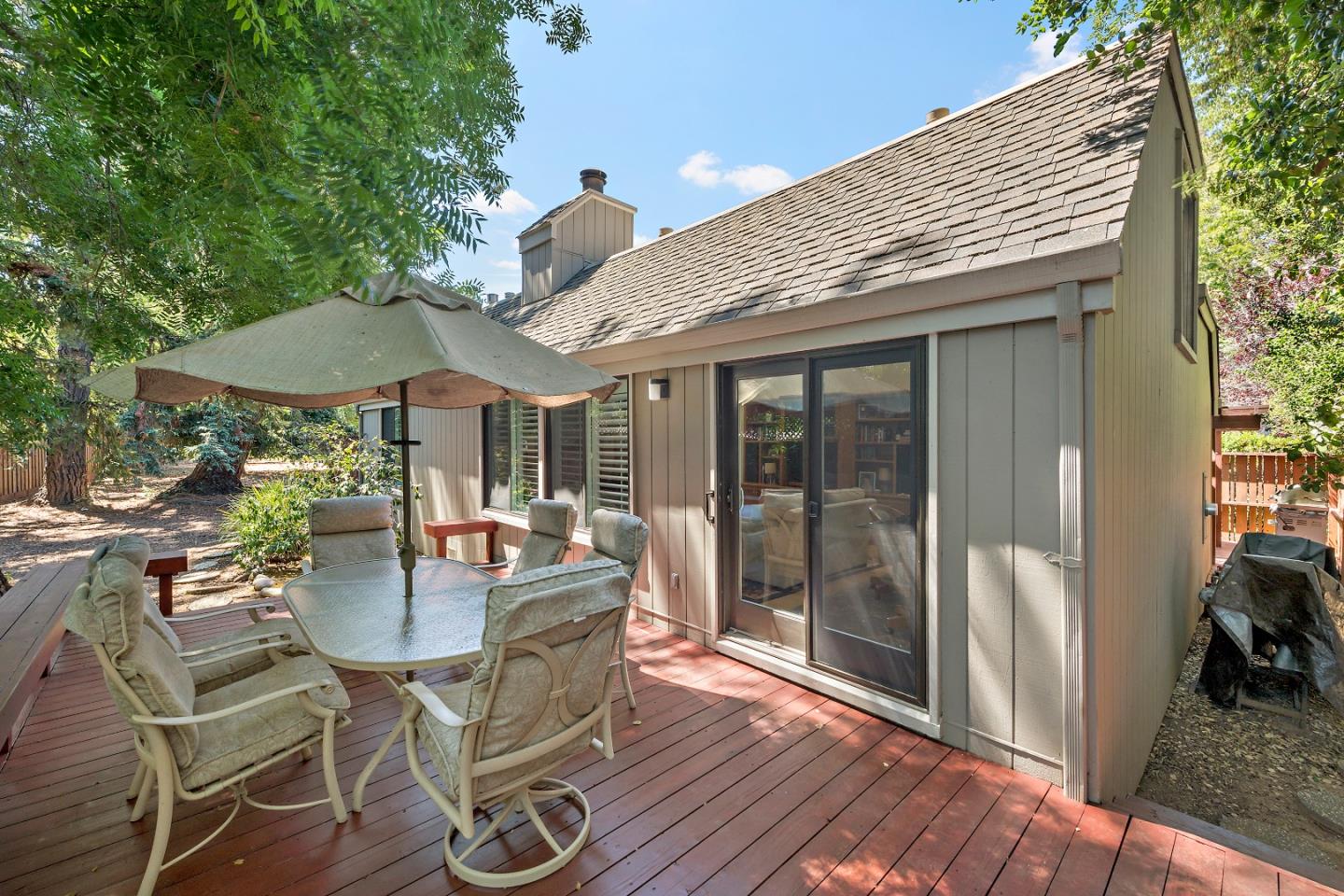 18 Farm Road Los Altos, CA 94024 - Photo 23 of 27 a patio with a table and chairs and wooden floor