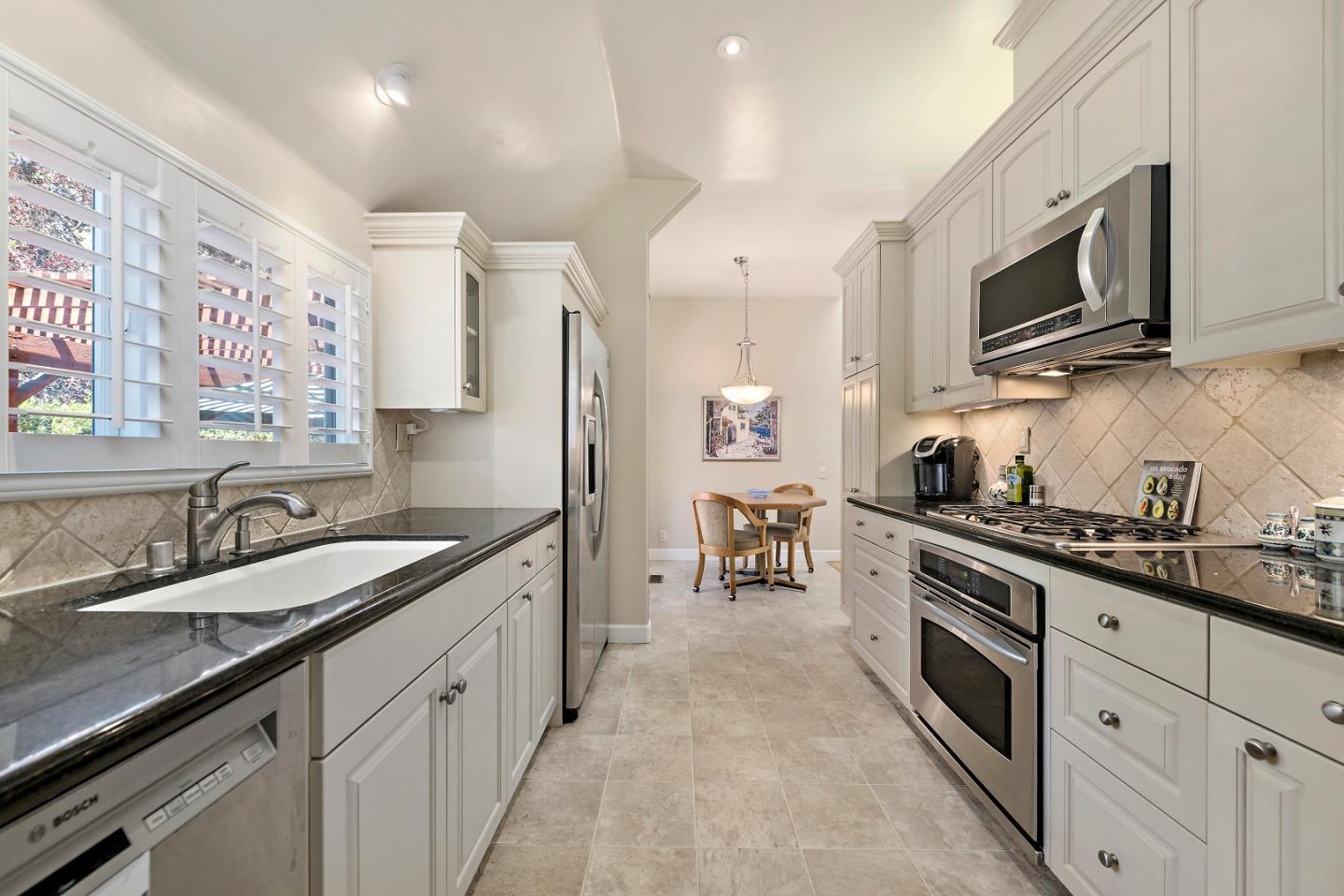 18 Farm Road Los Altos, CA 94024 - Photo 5 of 27 a kitchen with a sink stove and microwave