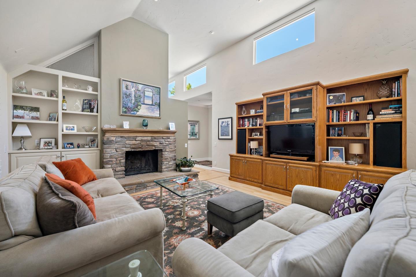 18 Farm Road Los Altos, CA 94024 - Photo 9 of 27 a living room with furniture a flat screen tv and a fireplace