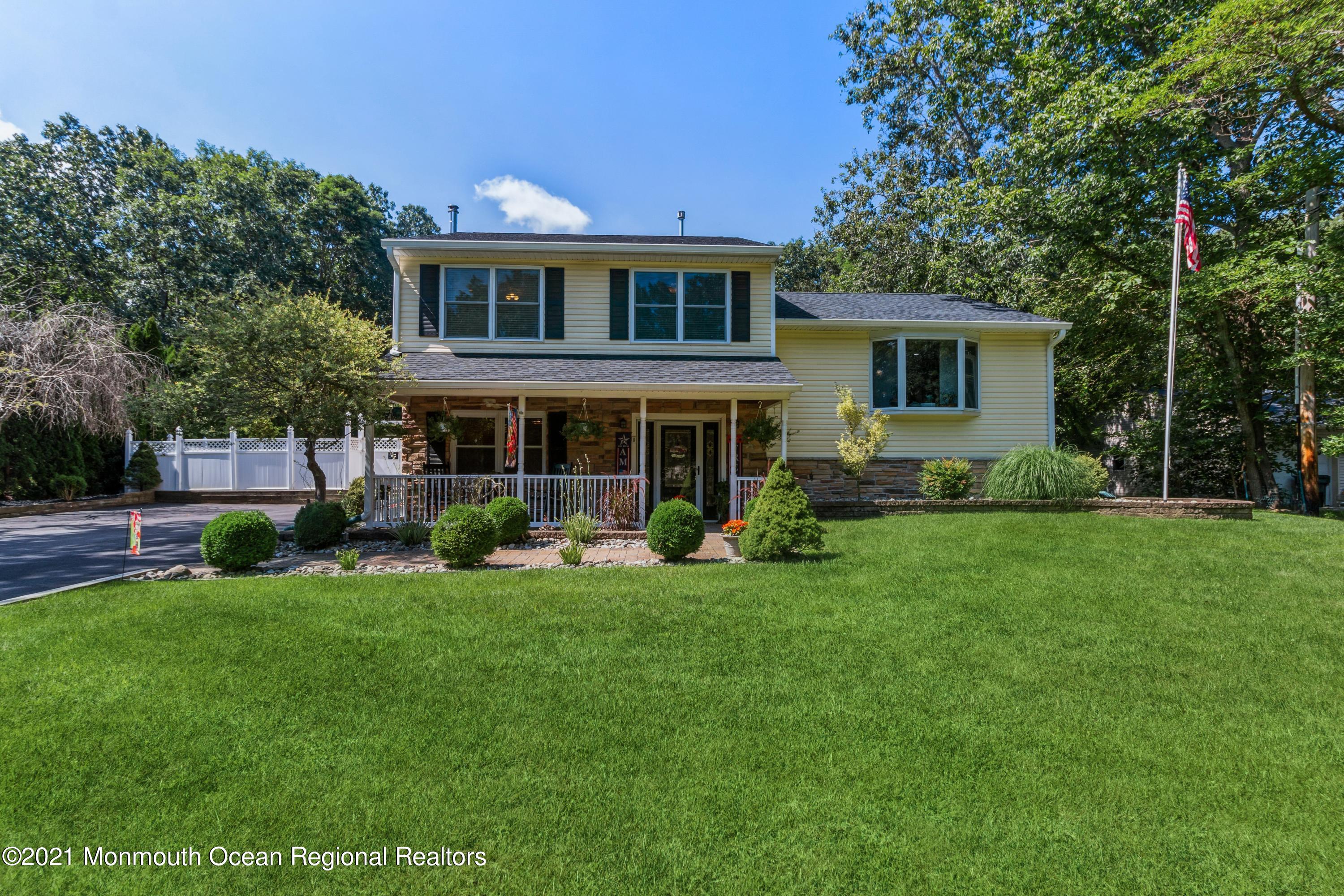 258 Sunnybrook Road Jackson, NJ 08527 - Photo 1 of 20 a front view of house with yard and green space