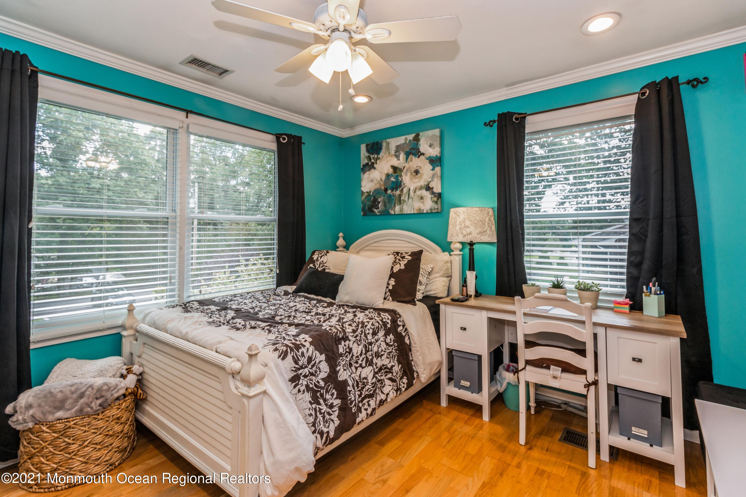 258 Sunnybrook Road Jackson, NJ 08527 - Photo 13 of 20 a bedroom with a bed and a table