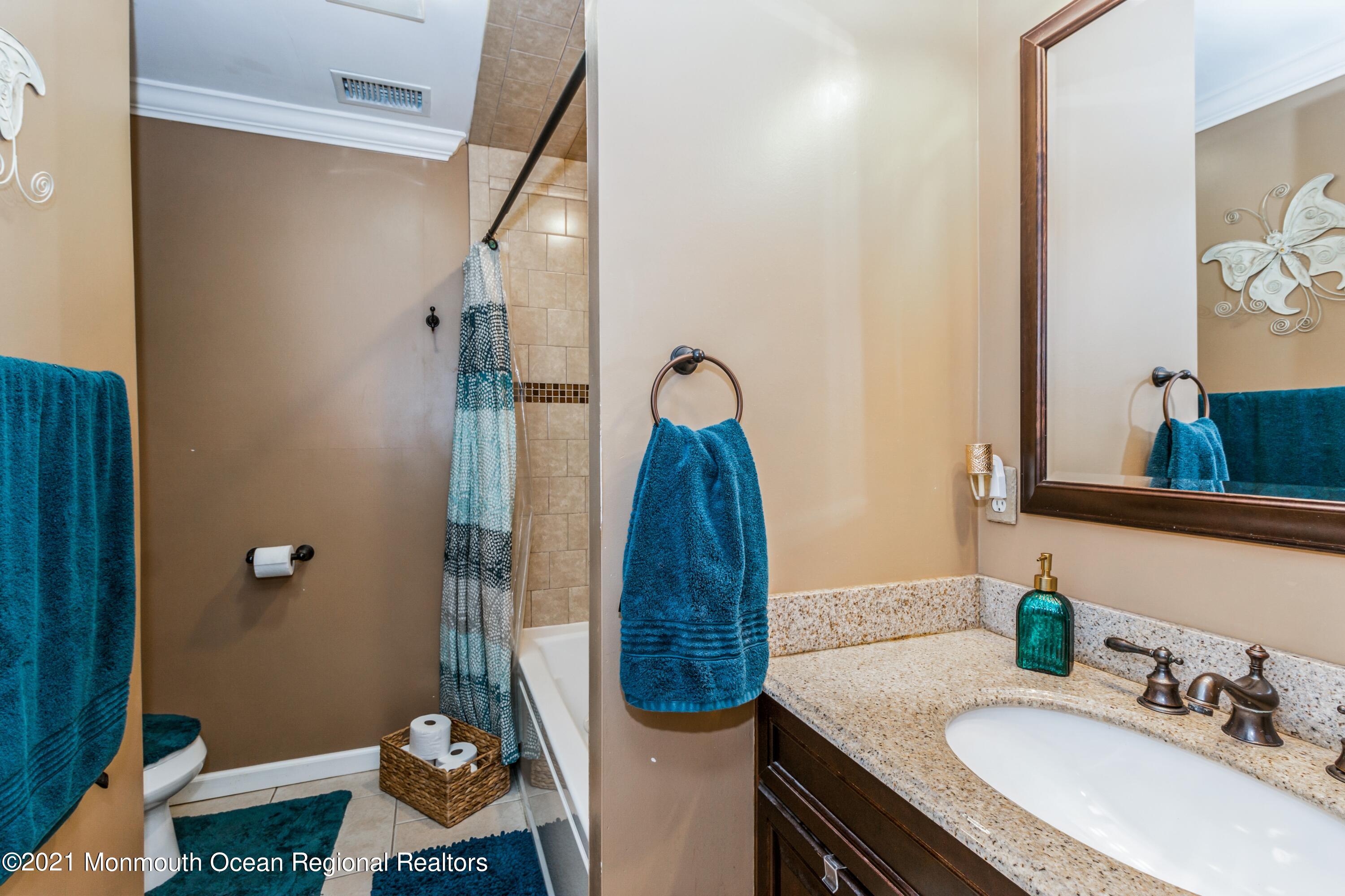 258 Sunnybrook Road Jackson, NJ 08527 - Photo 15 of 20 a bathroom with a sink and a mirror