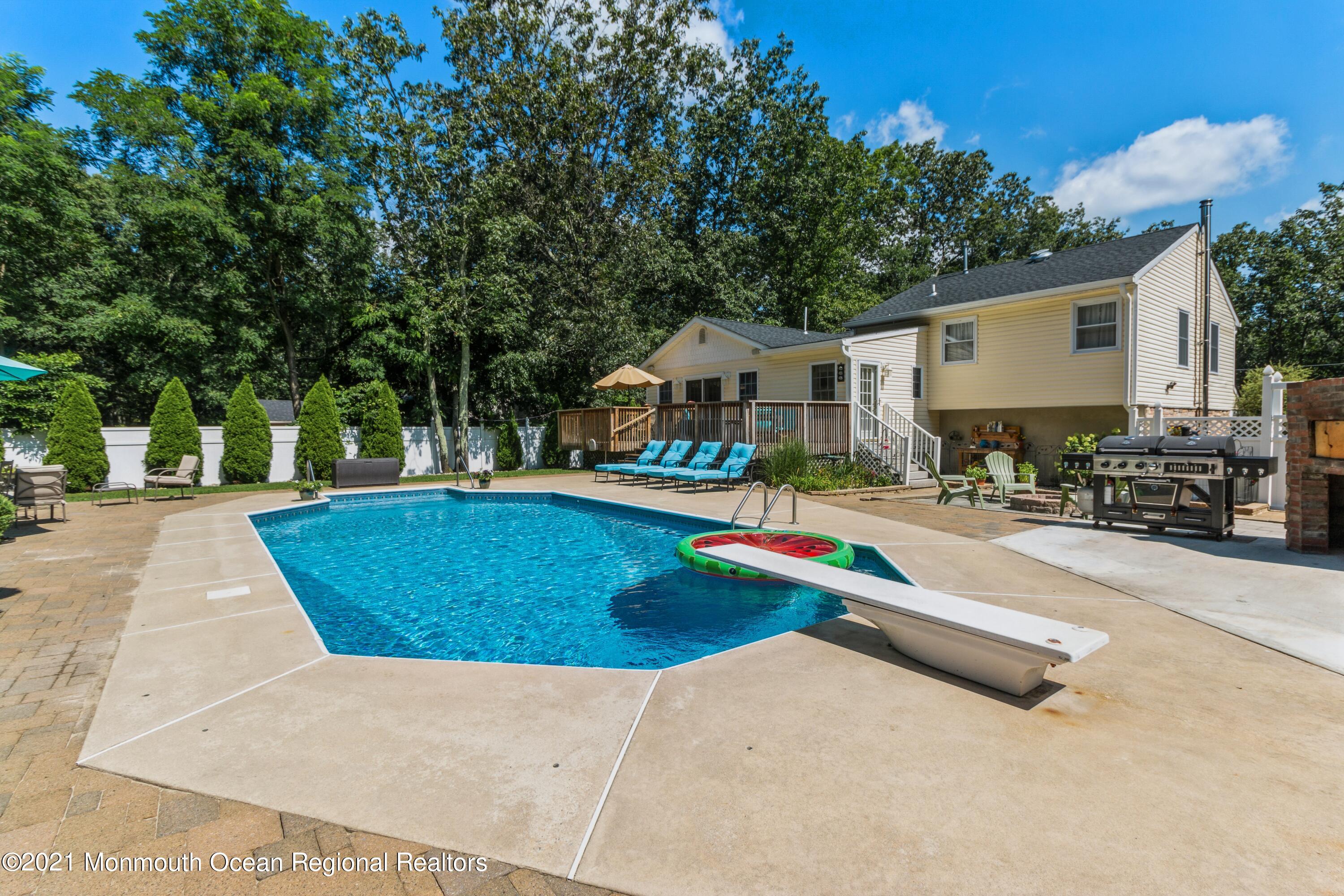 258 Sunnybrook Road Jackson, NJ 08527 - Photo 18 of 20 a view of outdoor space with seating area and trees around