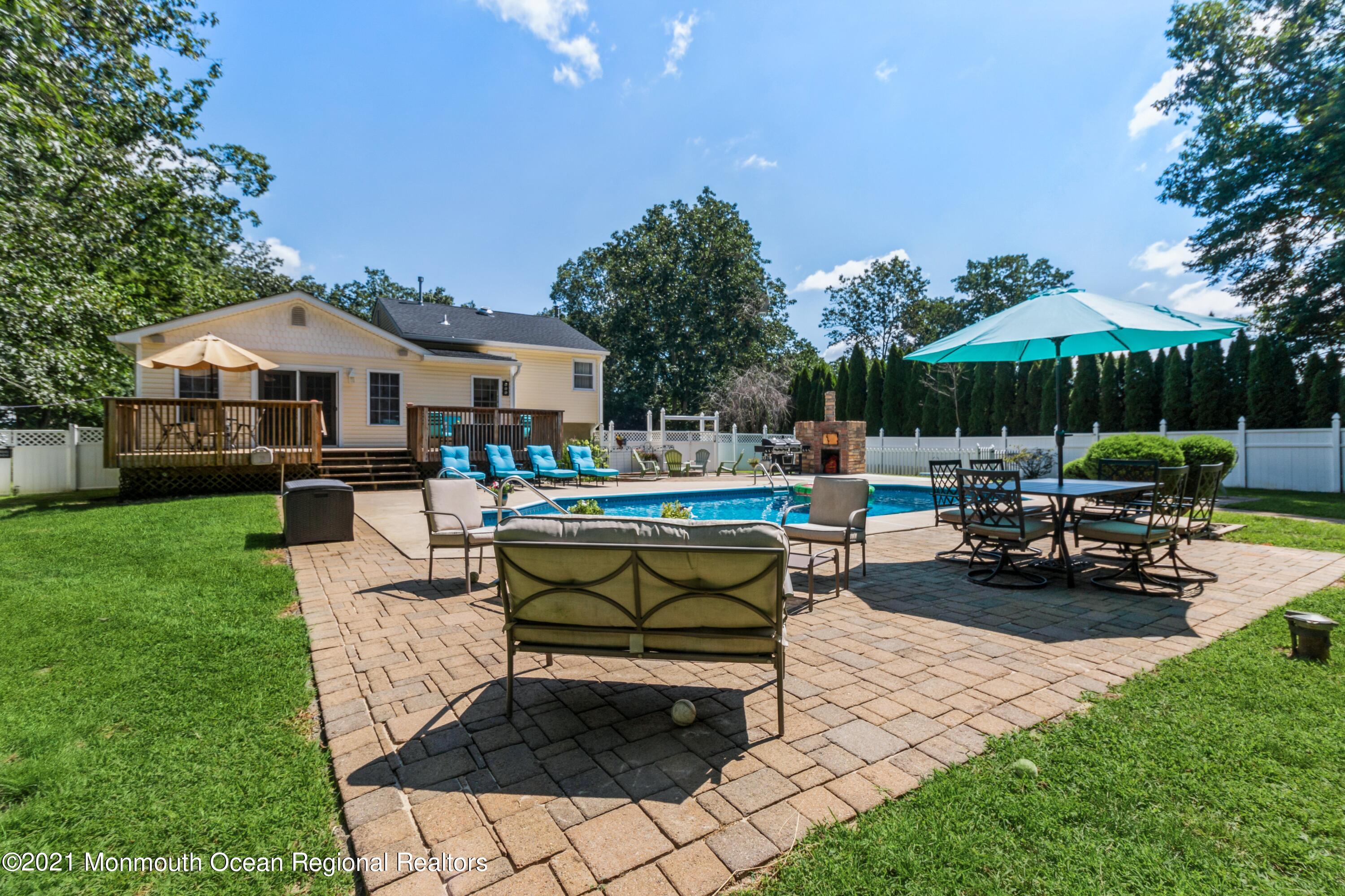 258 Sunnybrook Road Jackson, NJ 08527 - Photo 19 of 20 a view of a backyard with sitting area and furniture