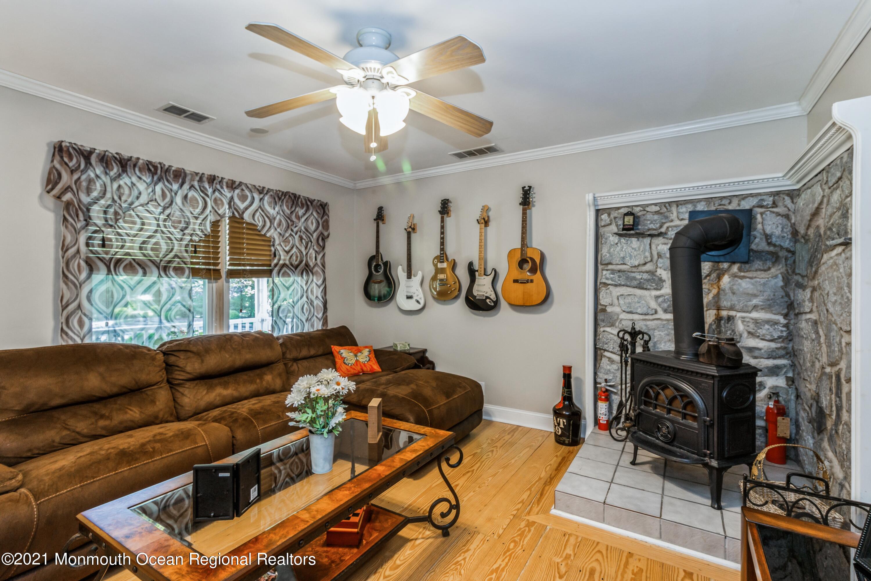 258 Sunnybrook Road Jackson, NJ 08527 - Photo 10 of 20 a living room with furniture a chandelier and a large window