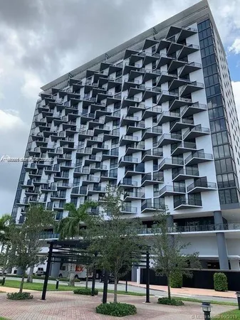 a view of a building with a street
