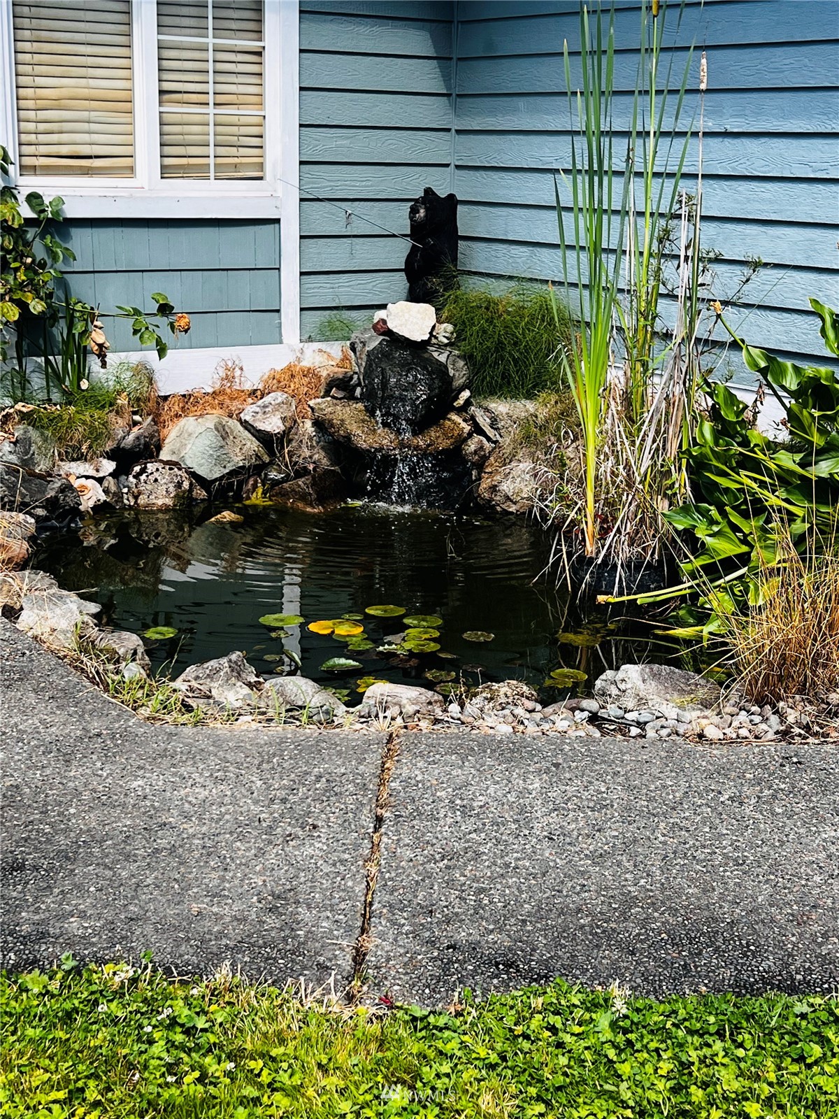 4910 Parker Road East Sumner, WA 98390 - Photo 3 of 16 a backyard of a house with lots of green space