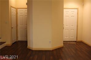 207 Priority Point Street Henderson, NV 89012 - Photo 10 of 23 Rich wood-look flooring and clean neutral walls welcome visitors at the front entry.