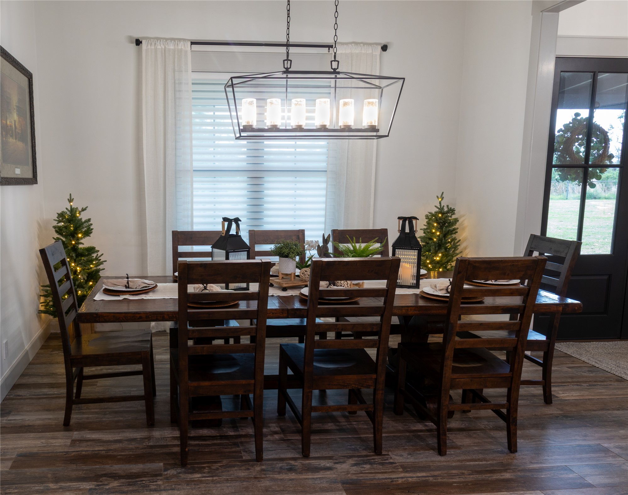 272 Slate Rock Road Fredericksburg, TX 78624 - Photo 14 of 32 Hardwood-look tile flooring extends across this spacious dining area providing plenty of space for holiday dinners.