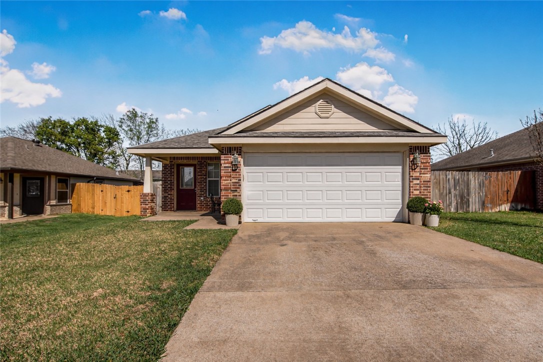 1002 Copperas Bend Caldwell, TX 77836 - Photo 1 of 22 a front view of a house with a yard and garage