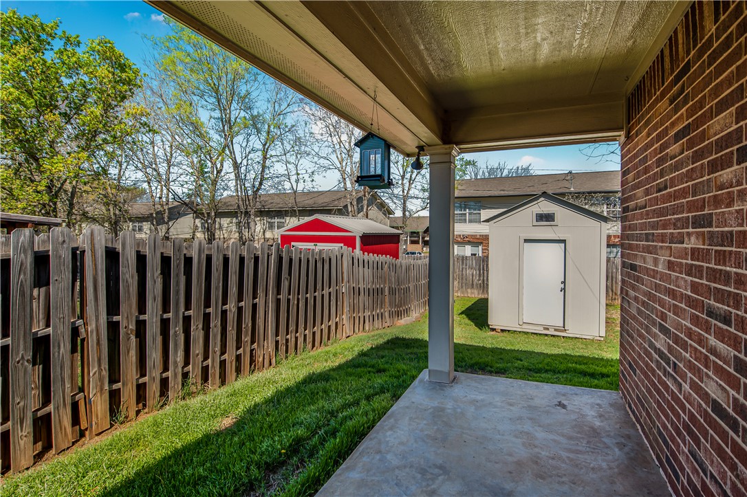 1002 Copperas Bend Caldwell, TX 77836 - Photo 18 of 22 a view of a house with a small yard and a large tree