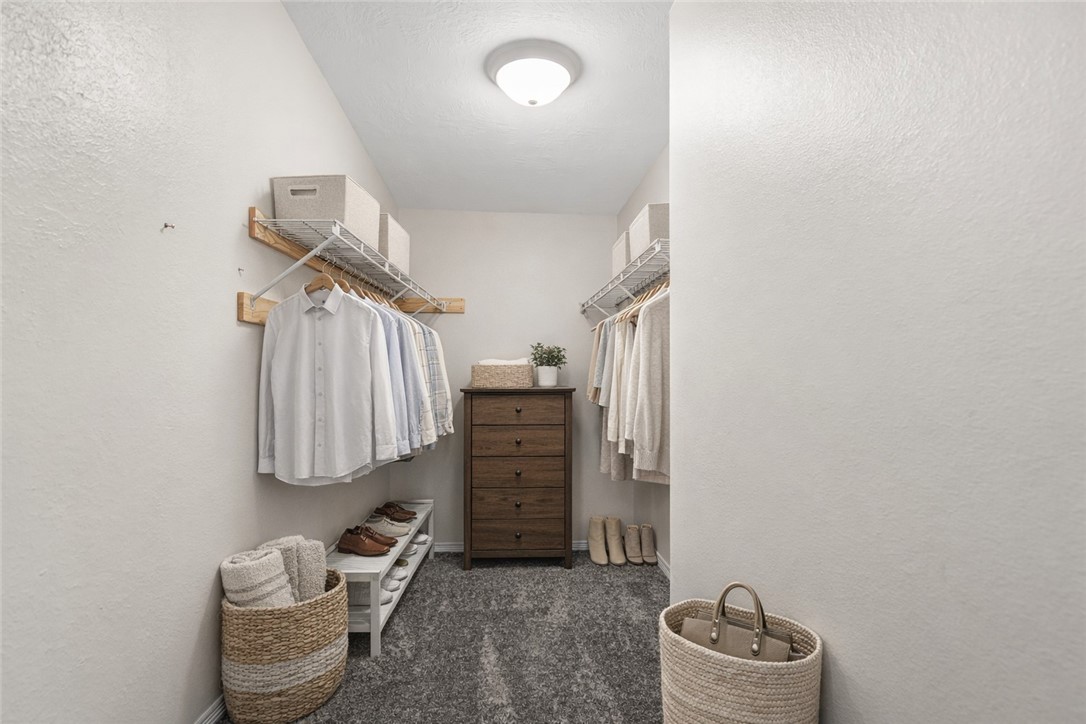 1002 Copperas Bend Caldwell, TX 77836 - Photo 6 of 22 a view of walk in closet with clothes and shoes
