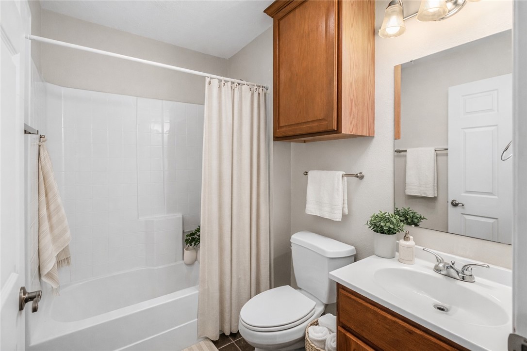 1002 Copperas Bend Caldwell, TX 77836 - Photo 9 of 22 a bathroom with a sink toilet and shower