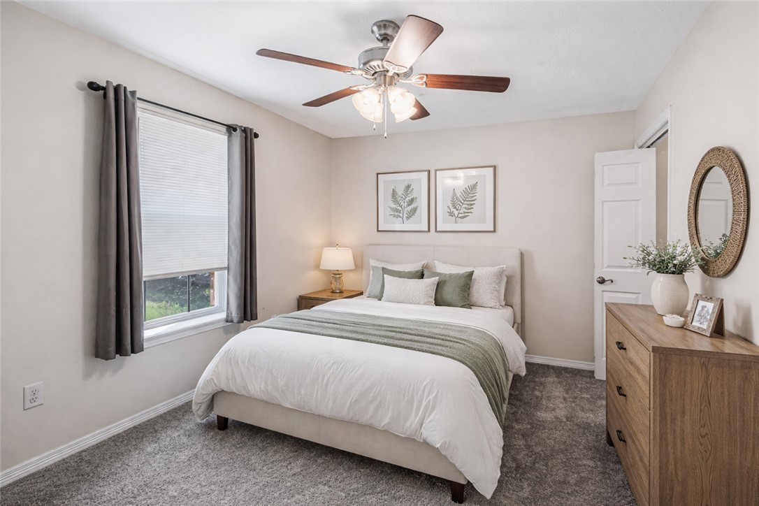 1002 Copperas Bend Caldwell, TX 77836 - Photo 10 of 22 a bedroom with a large bed and a chandelier