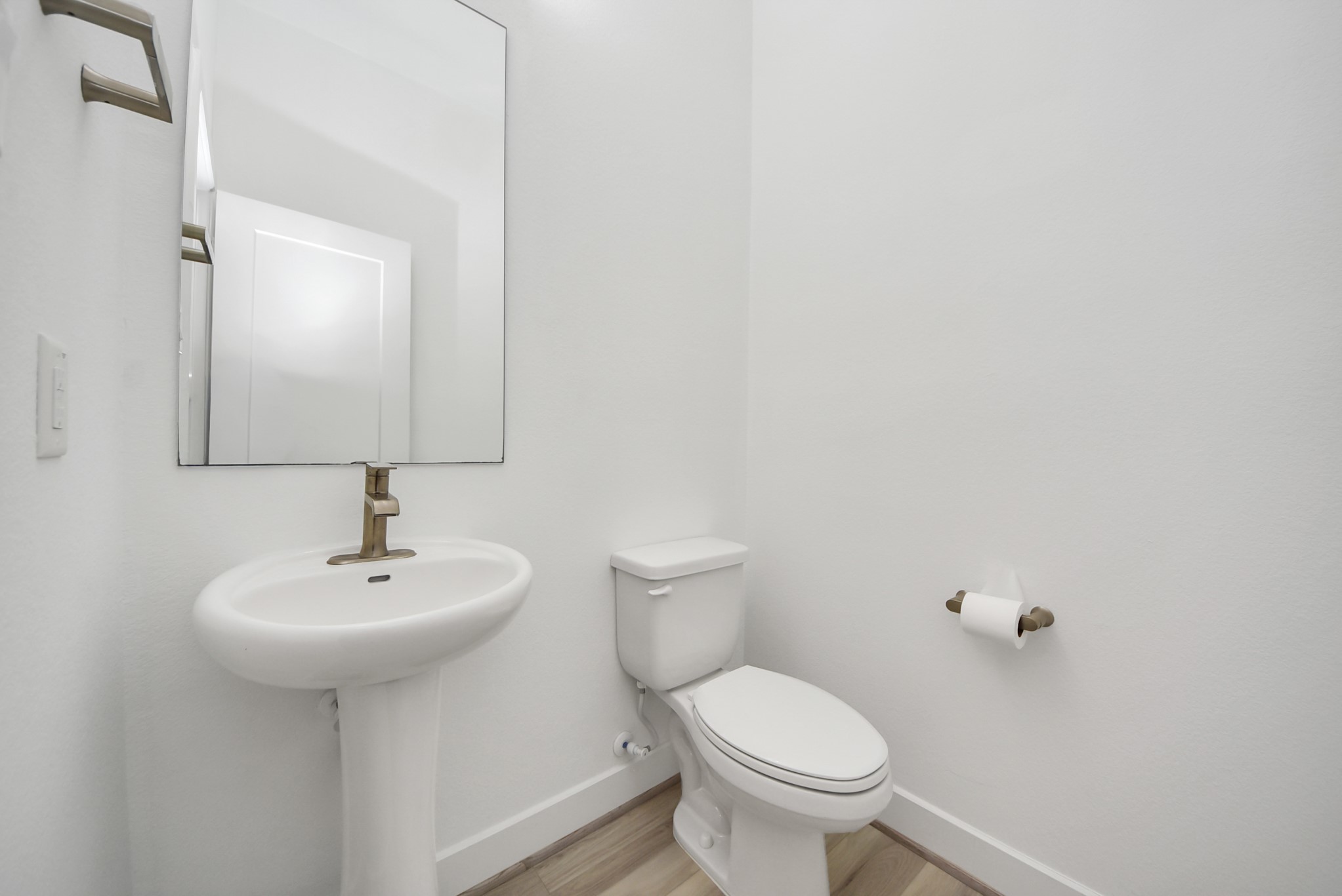18716 Centro Main Street Conroe, TX 77385 - Photo 23 of 50 Convenient half bath located on the main living level, ideal for guests and everyday functionality.