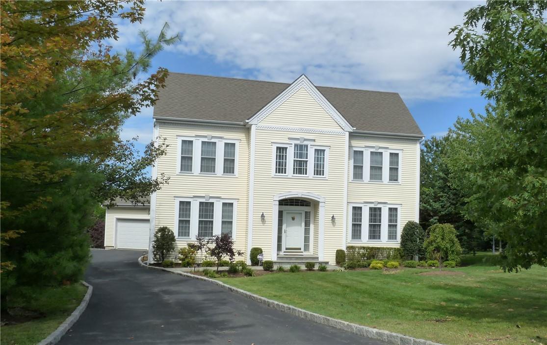 28 Legendary Circle Rye Brook, NY 10573 - Photo 1 of 1 a view of a white house with yard and plants