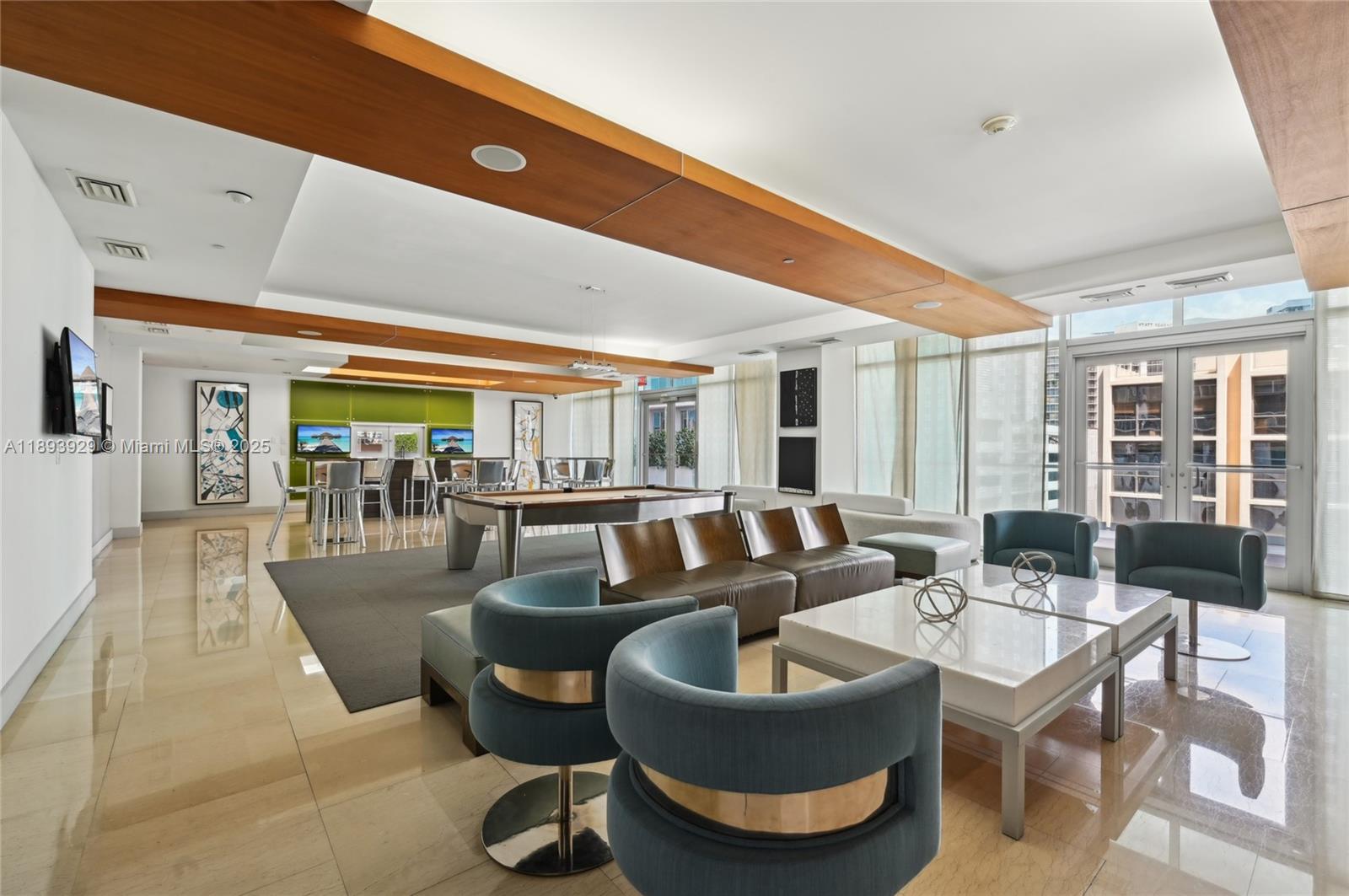 55 Southeast 6th Street, Unit 1608 Miami, FL 33131 - Photo 14 of 24 a living room with patio furniture and a large window