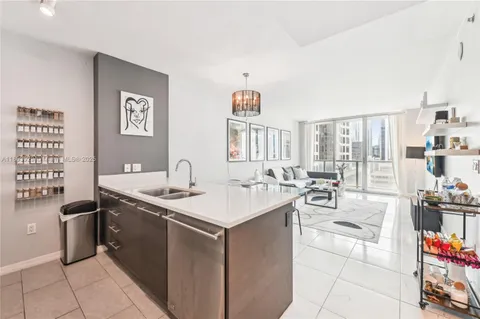 a spacious bathroom with a sink and a mirror