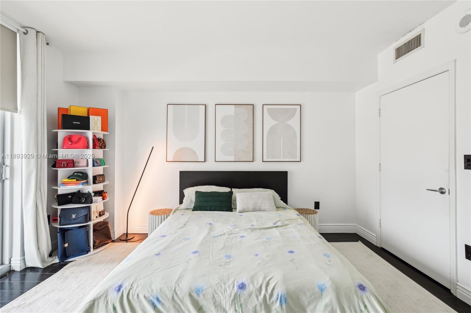 55 Southeast 6th Street, Unit 1608 Miami, FL 33131 - Photo 10 of 24 a bedroom with a bed and closet