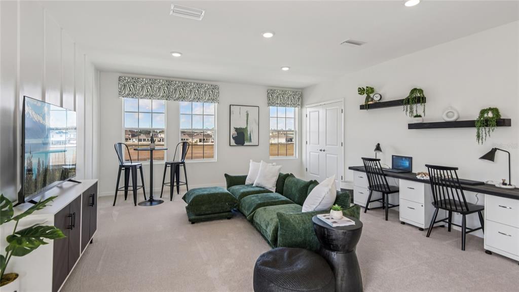 11238 Duckling Way Weeki Wachee, FL 34613 - Photo 15 of 30 a living room with fireplace furniture and a flat screen tv