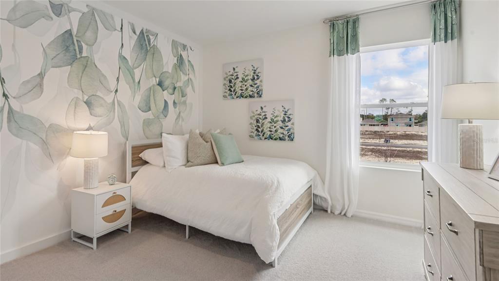 11238 Duckling Way Weeki Wachee, FL 34613 - Photo 24 of 30 a bedroom with a bed and a window