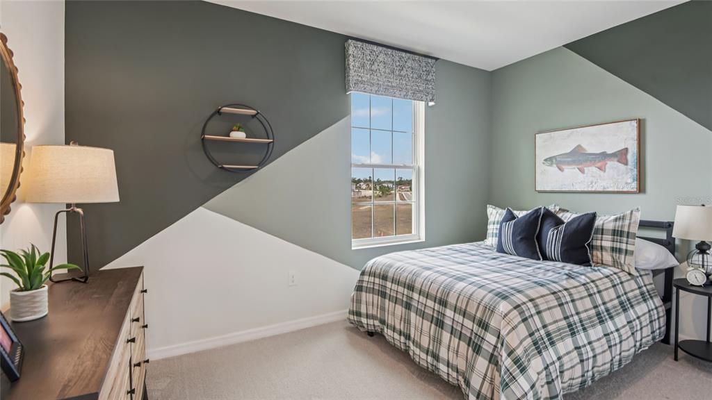 11238 Duckling Way Weeki Wachee, FL 34613 - Photo 26 of 30 a bedroom with double bed and a window