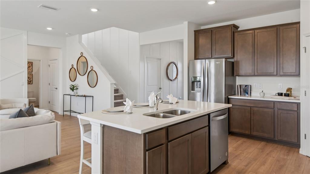 11238 Duckling Way Weeki Wachee, FL 34613 - Photo 6 of 30 a kitchen with a sink and a refrigerator