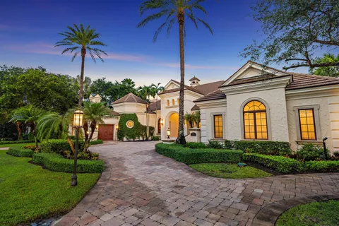 a kitchen with stainless steel appliances granite countertop a stove and cabinets