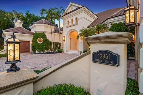 a view of a kitchen with cabinets and wooden floor