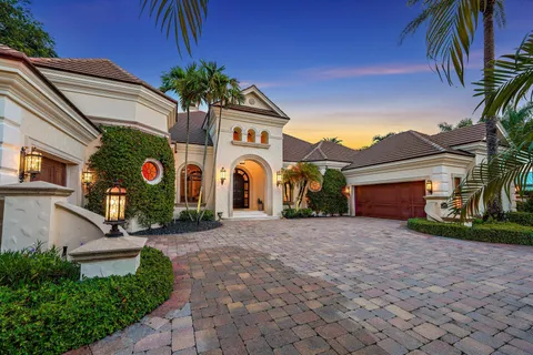 a kitchen with stainless steel appliances granite countertop a stove and cabinets