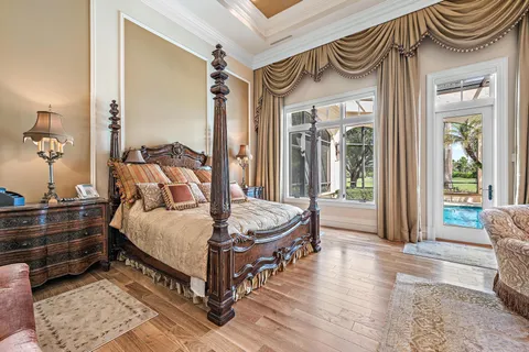 a bedroom with furniture and a baby crib