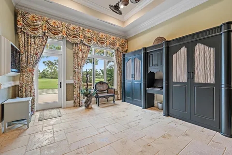 a swimming pool with outdoor seating and plants