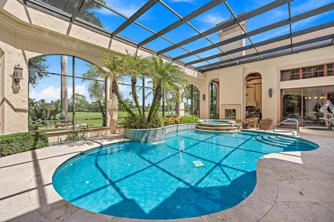 a view of a golf course with a swimming pool