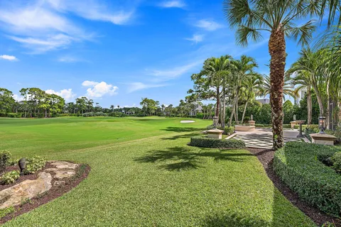 a view of swimming pool is middle in the garden