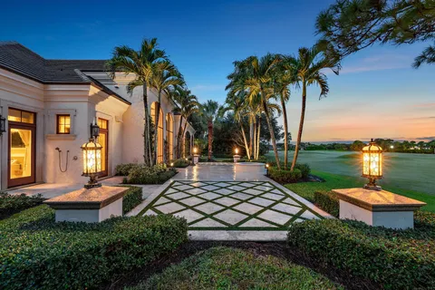 a view of a swimming pool with outdoor seating