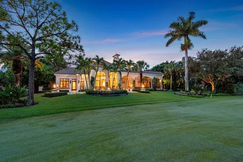a view of swimming pool with a lounge chairs