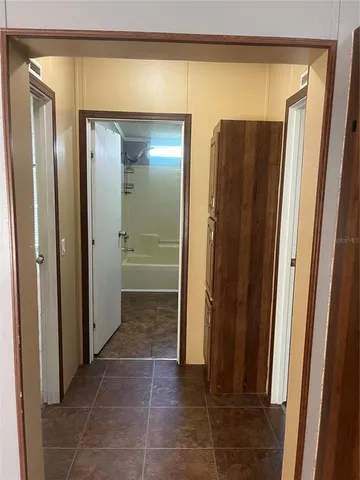 a view of a bathroom with a glass door and a glass door shower