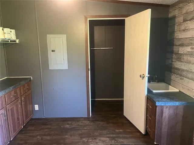 a view of a bathroom with sink and wooden floor