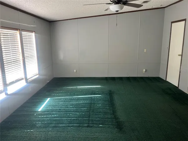 a view of room with window and a yard