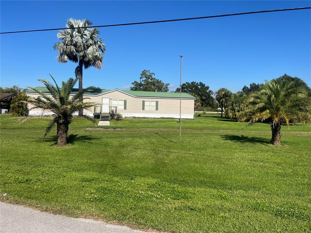 1145 Yaun Road Southeast Moore Haven, FL 33471 - Photo 2 of 26 a view of a garden