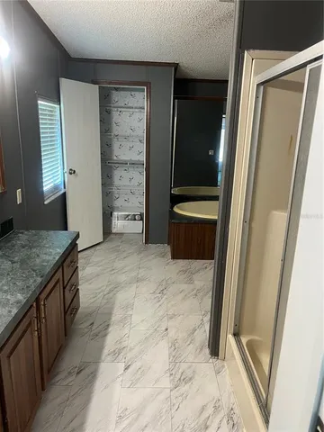 a view of kitchen with cabinets and wooden floor