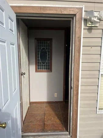 a view of a door and a window