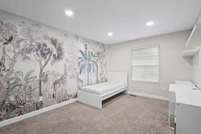 a living room with a couch and a window