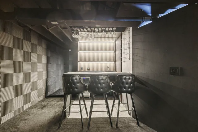 a room with a table and chairs in it