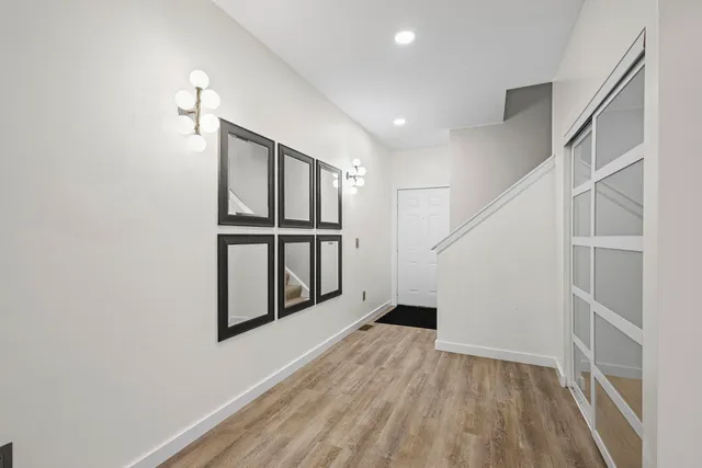 a view of entryway with wooden floor