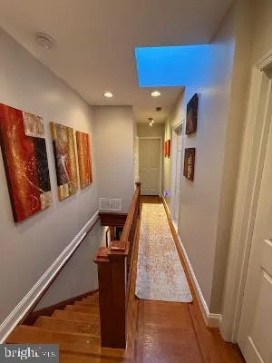 a view of a hallway with workspace