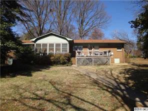 8404 Normandy Road Denver, NC 28037 - Photo 6 of 9 a front view of a house with a yard